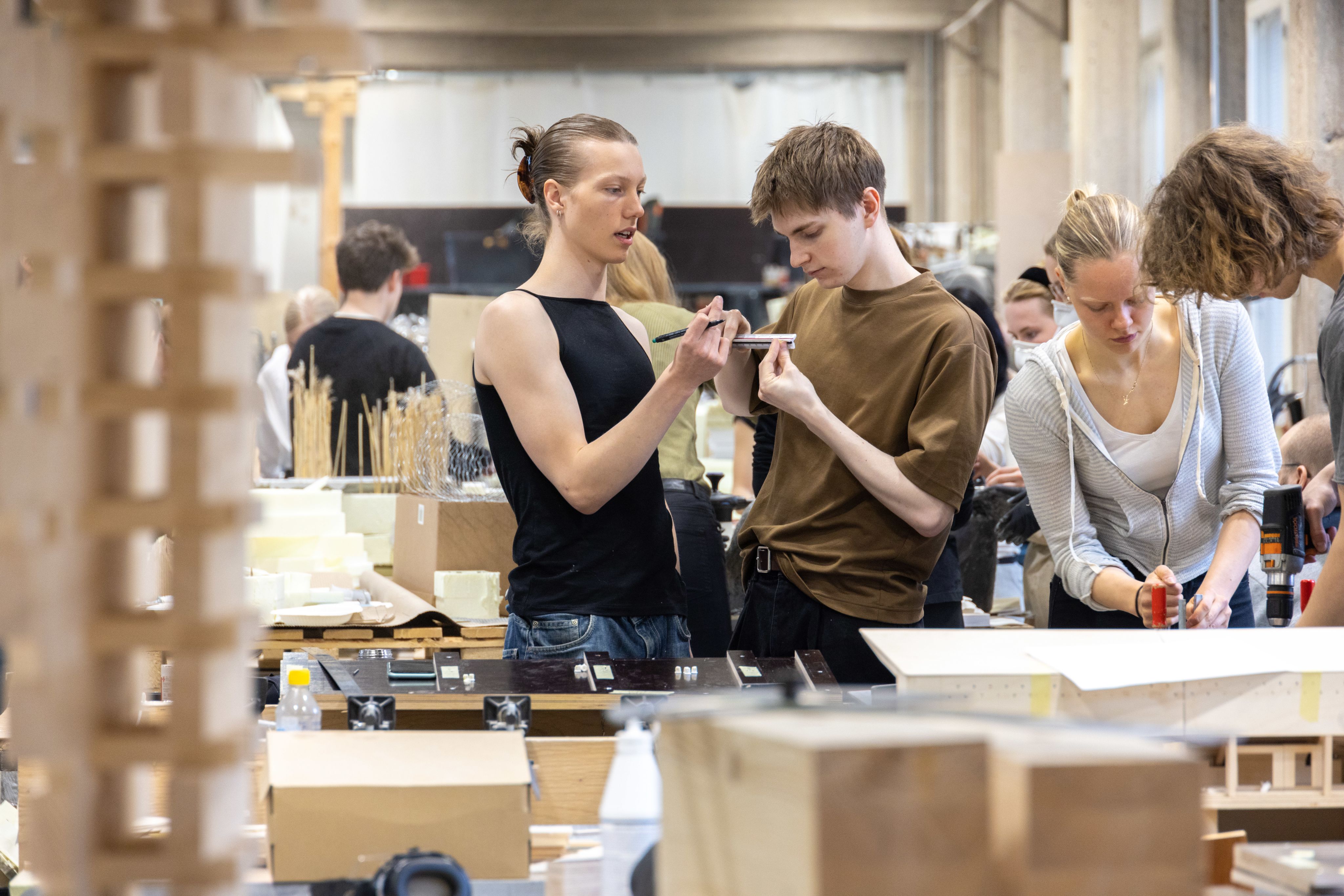 Students working: Aapo Olkkonen, Ivan Korhonen and Saga Luhtala. Photo: Mikko Raskinen/Aalto University