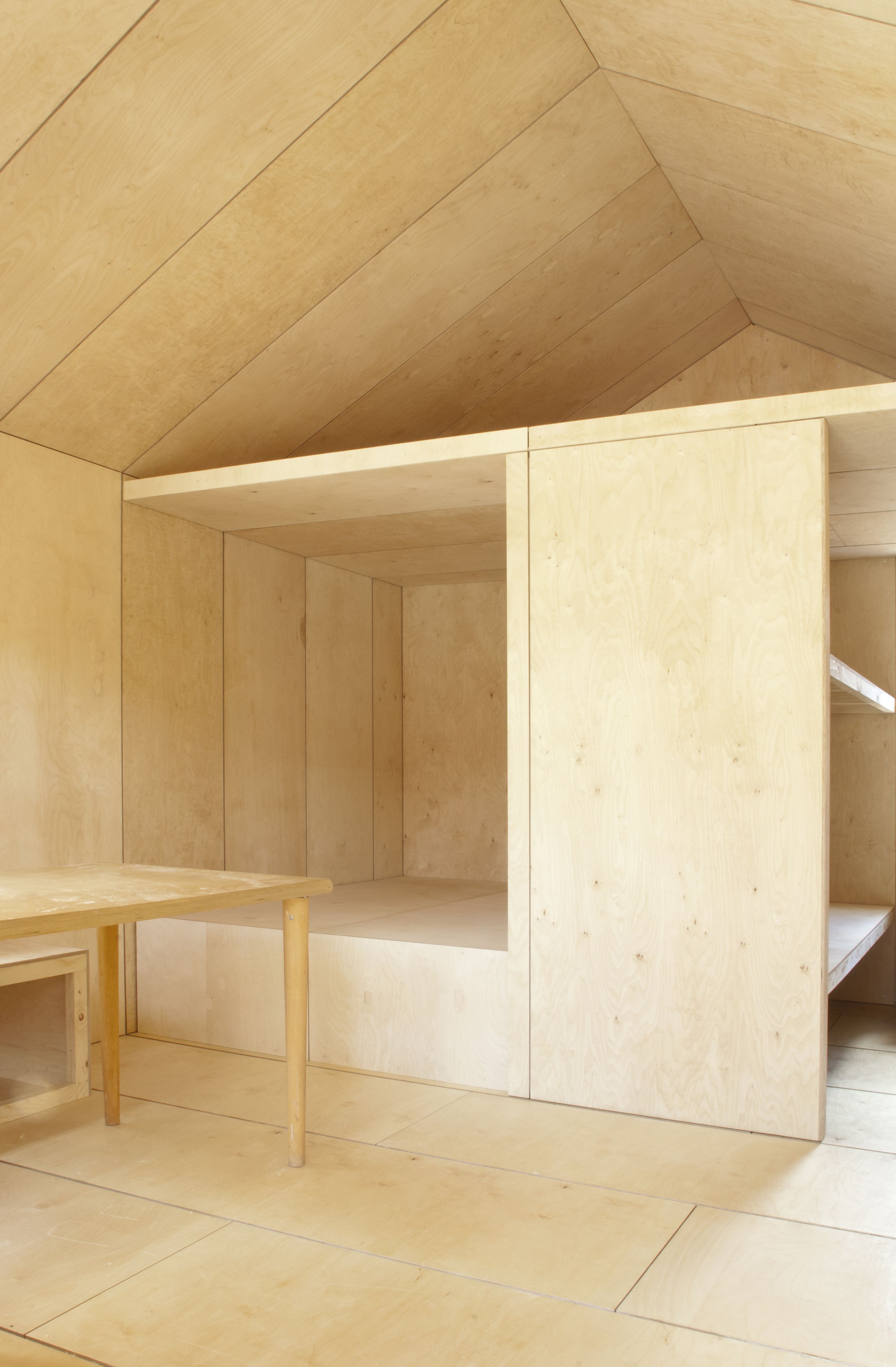 inside wooden house with living room or sleeping are