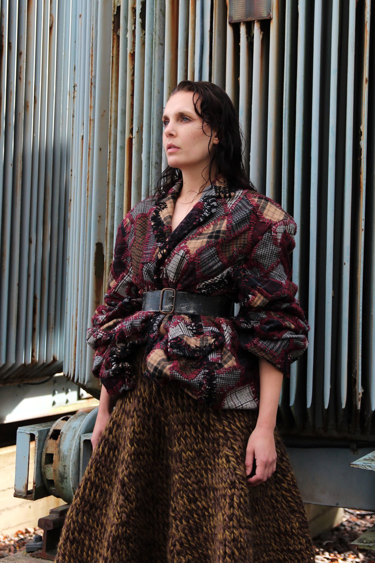 model wearing jacket and skirt in natural colors and textures