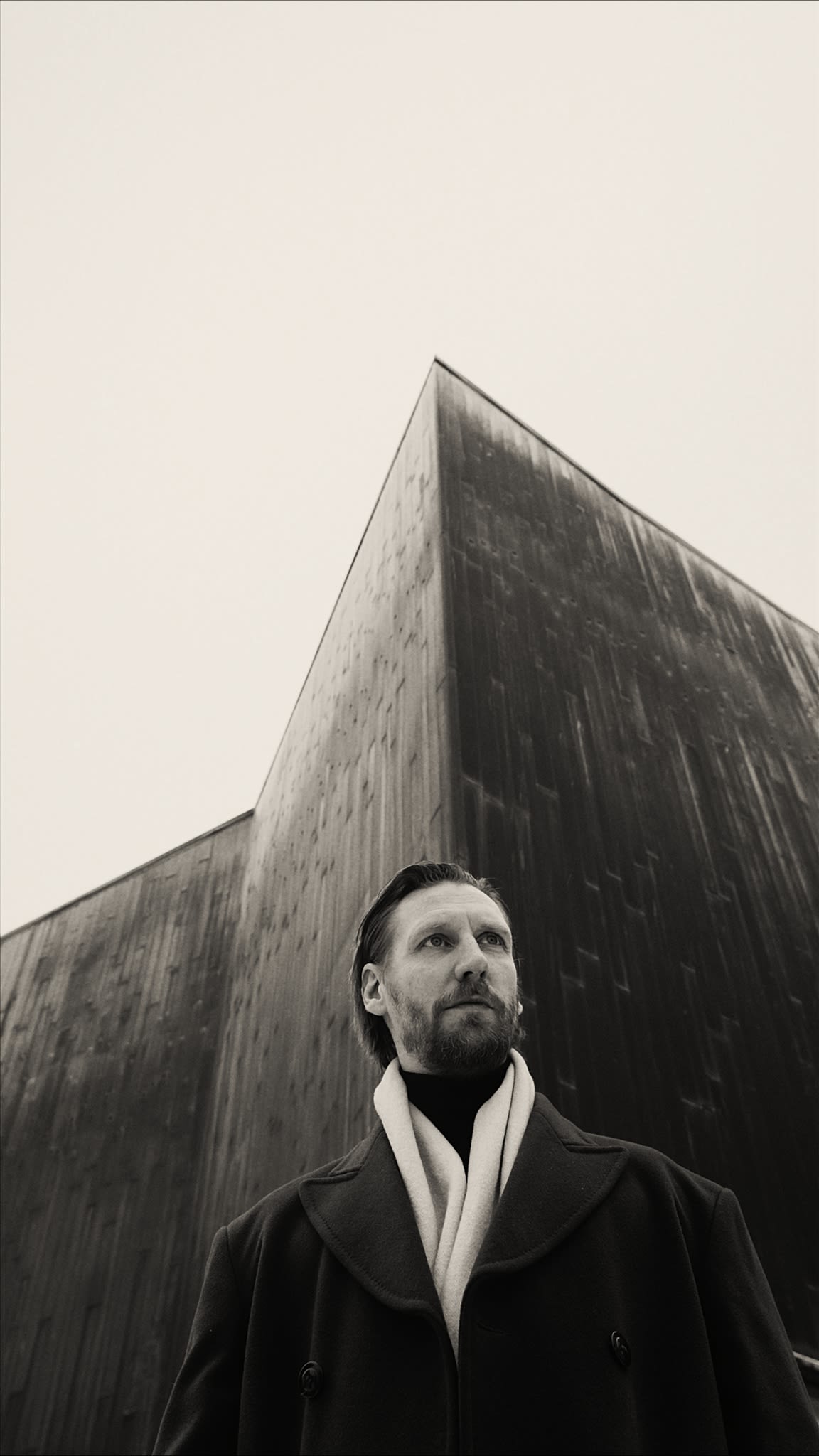 black and white picture of man looking away from the camera