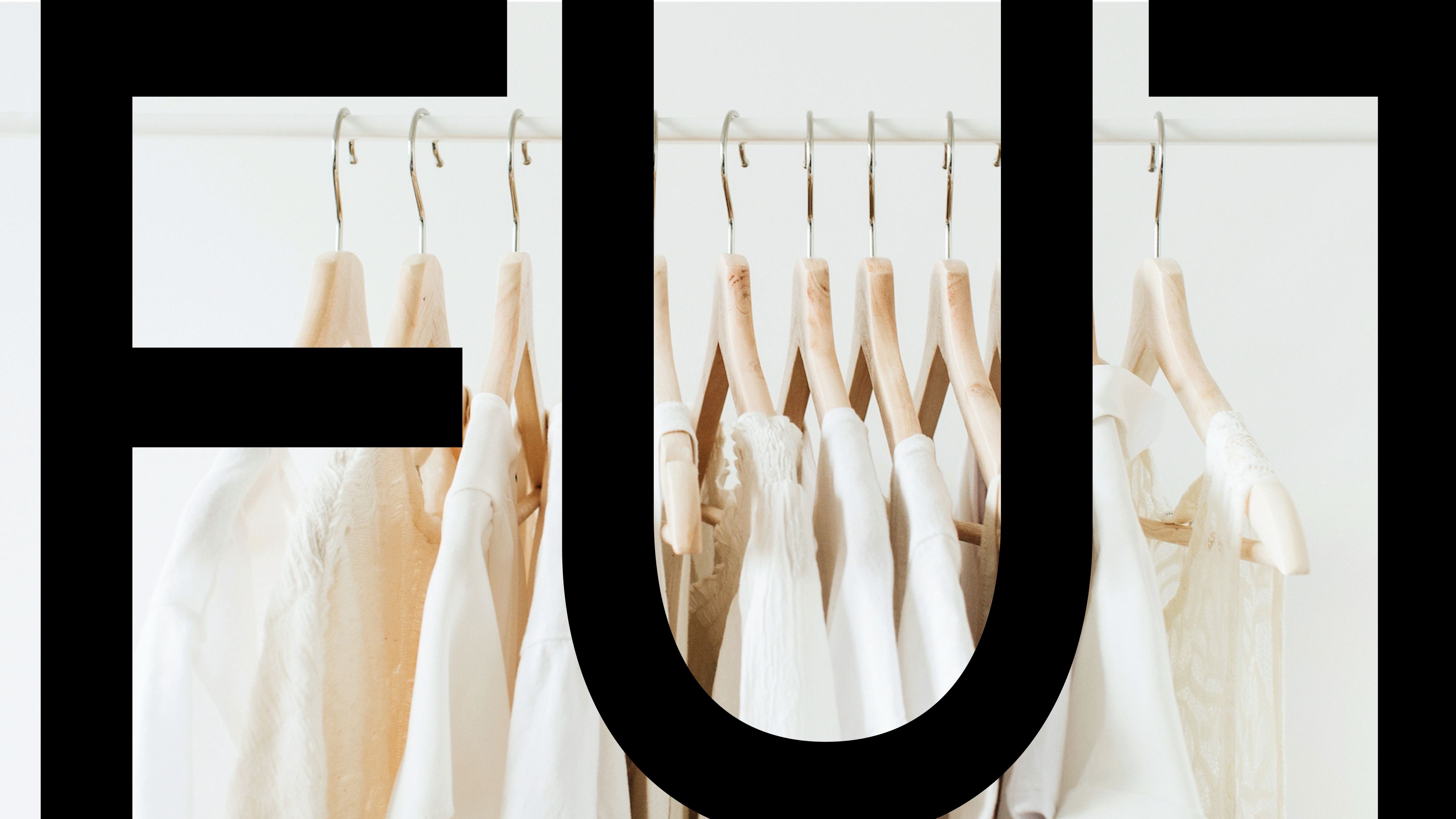 white shirt on clothing rack