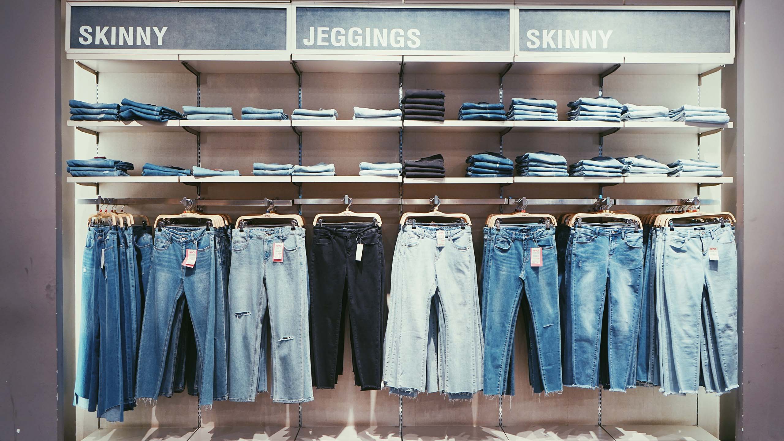 jeans on rack and shelves