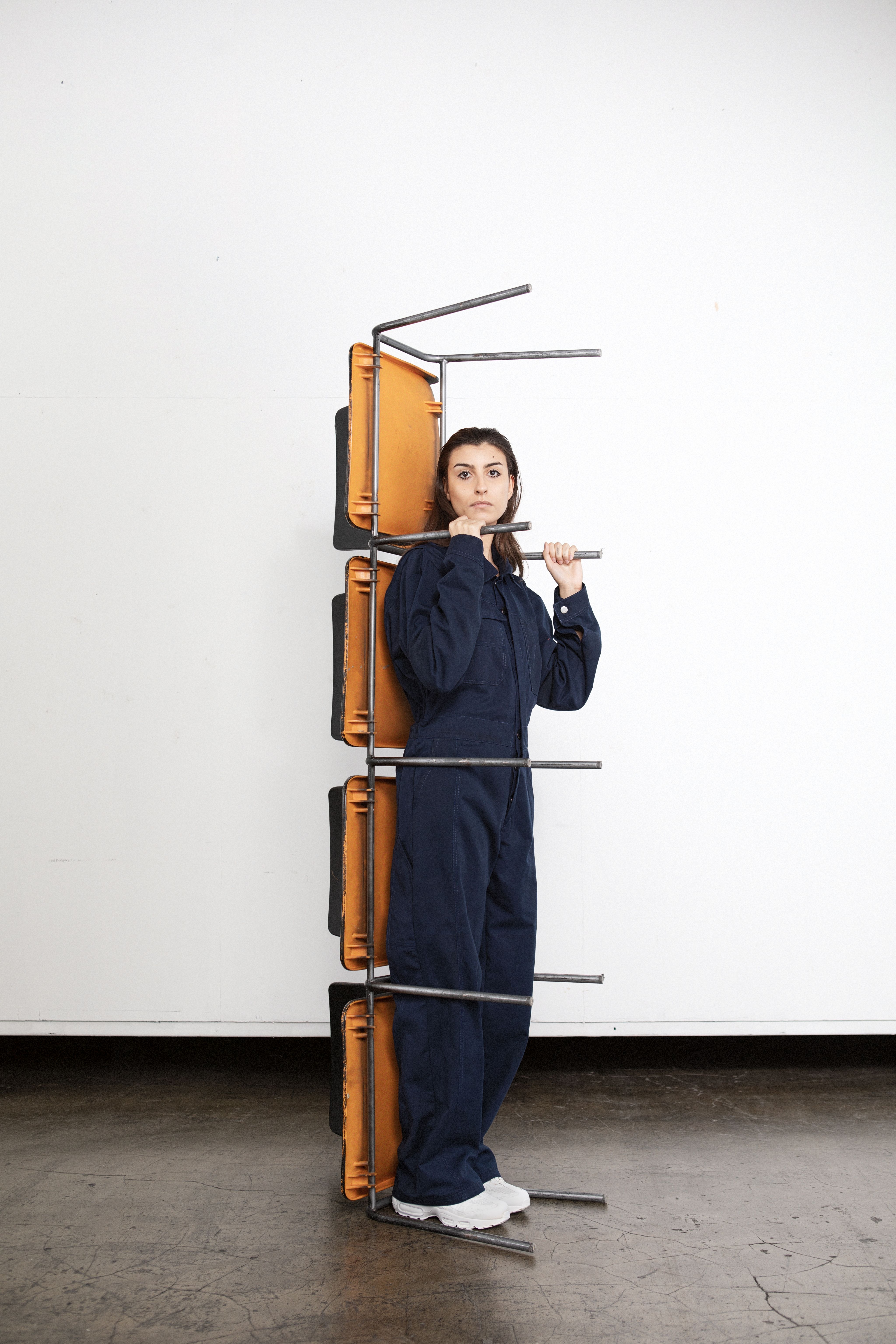 woman in dark blue boiler suit