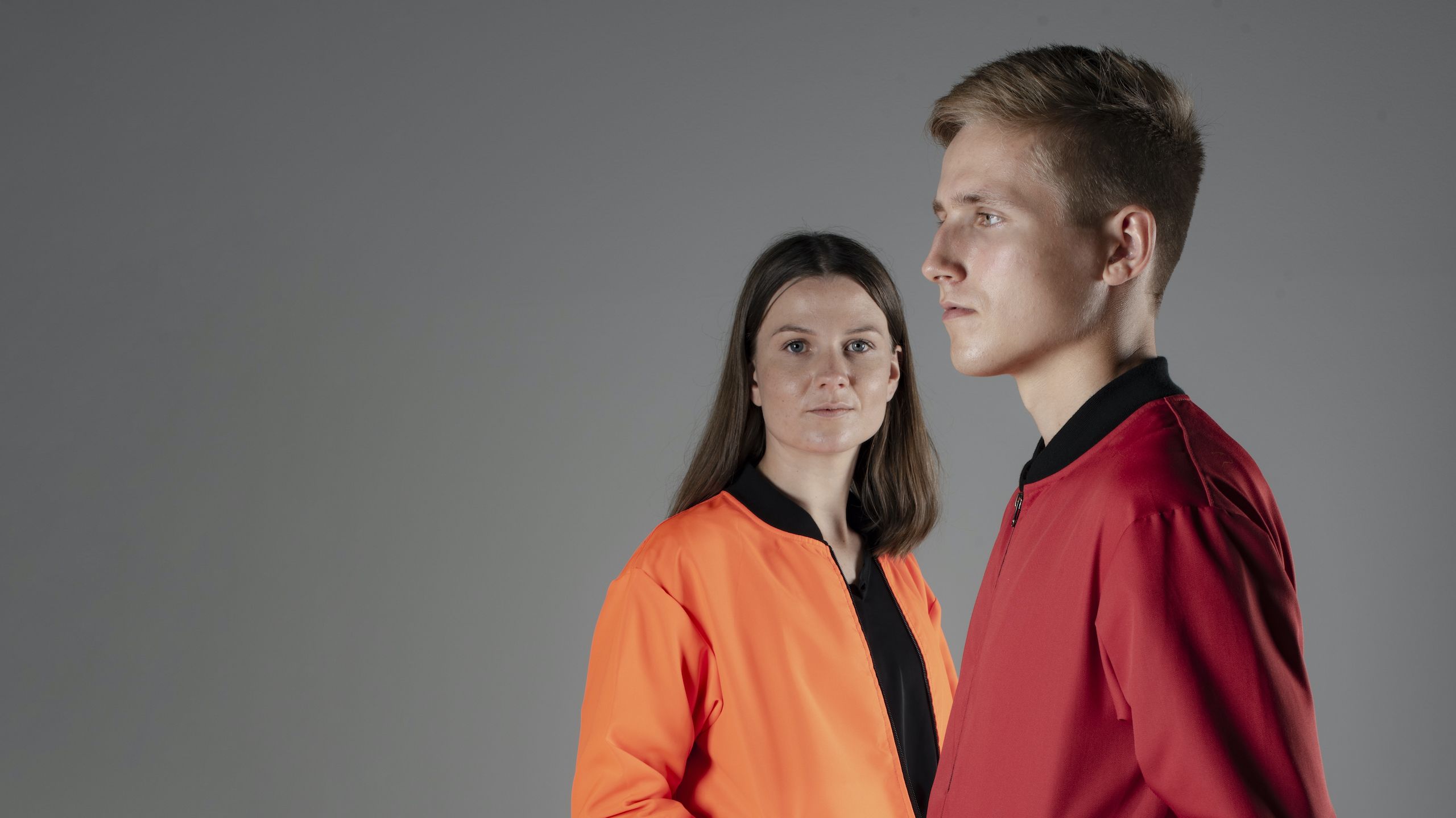 man and woman in jackets with solar panels